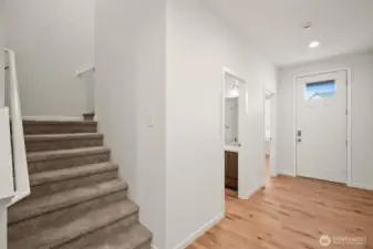 heading back out of the living room, you'll find the main floor bath & bedroom