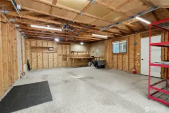 Spacious Garage with custom epoxy flooring