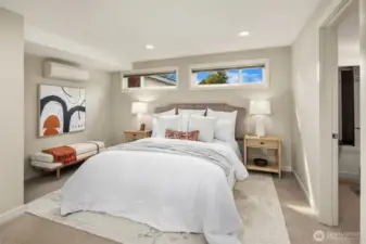 Primary bedroom easily fits King bed with walk-in closet, bath, sitting area and laundry.