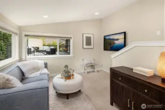 Private sitting area/den off primary bedroom suite.