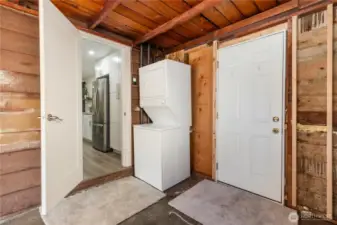 Easy access to washer and dryer as well as another door to backyard.