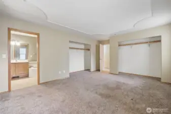 Another view of the primary bedroom suite.