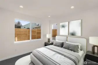 Bright secondary bedroom offering versatile space for guests or a home office