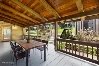 Covered back porch virtually staged to show how this space can be enjoyed for gatherings and everyday living.