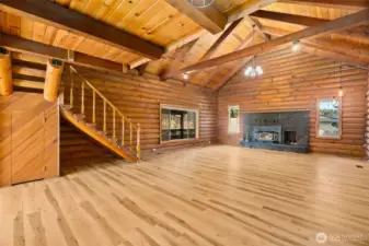 The open log staircase highlighting the timeless craftsmanship of true log construction.