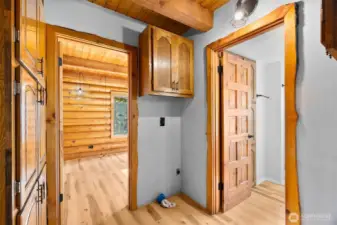Laundry room with built-in storage and easy access to the ¾ bath, kitchen and main floor bedroom. This photo showcases the beautiful trim.