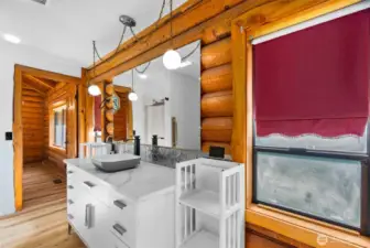 Natural light, a new white vanity, and light countertops create a bright and refreshed upstairs bath.