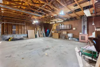 Garage interior - Oversized garage with built-in workspace — perfect for projects, tools, and creativity. (some personal items virtually removed).