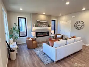 Cozy living room with electric LED fireplace with various heat controls.