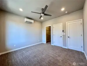 Primary Bedroom with walk-in closet and secondary closet for storage.
