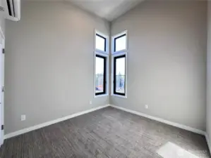 Bedroom 3 features vaulted ceiling and a lot of natural light.