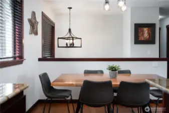 Dining area with vaulted ceilings + updated lighting