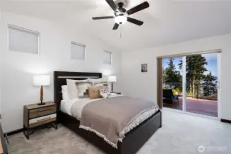 Primary bedroom located on upper level with full walk in closet + deck access.