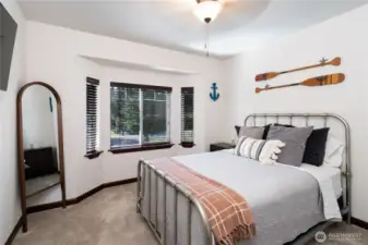 Second bedroom located on upper level of the home with closet space