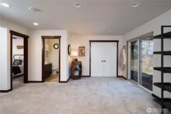 Lower level with laundry space + access to office + 3/4 bath with shower + outdoor covered patio