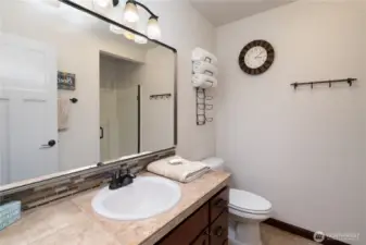 Well-maintained lower level bathroom with walk-in shower