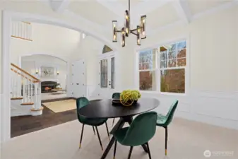 The formal dining room next to the grand stair. New paint, carpet and lighting.