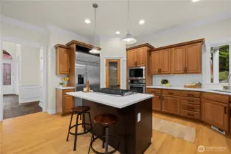 New cooktop in the island. New lighting and fresh paint in the kitchen. Solid surface countertops and plenty of storage.