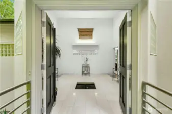 Grand entryway with a water fountain welcomes you home.