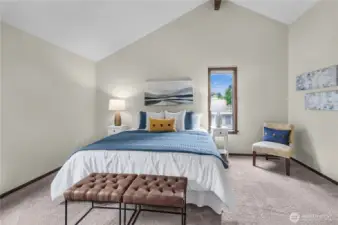 Upstairs original primary bedroom with vaulted ceilings.