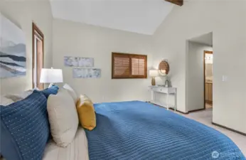 Upstairs original primary bedroom with vaulted ceilings.