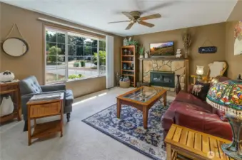 Large Great Room with wood burning stove with fan