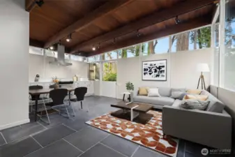 Virtually staged, Classic MCM. Seamless spatial integration of living, dining, and kitchen areas.