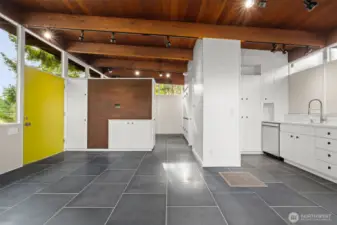Classic MCM. Seamless spatial integration of living, dining, and kitchen areas.  TV wall ready with hidden cabinet for cords.