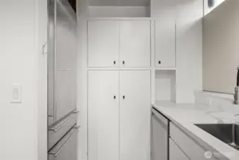 Sleek, functional kitchen with ample counter surfaces and smart cabinet storage.