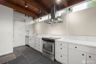 Sleek, functional kitchen with ample counter surfaces and smart cabinet storage.