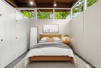 Virtually staged primary retreat designed with smart storage solutions, freeing the room from the need for extra furniture.