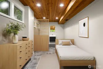 Lower level flex space virtually staged as bedroom. Half bath has been added.  System ready to install shower.  Short term rental space? Separate entrance.