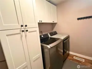 Laundry room has lots of extra storage
