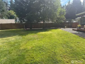 You may want to zoom into this picture to see the fully fenced dog kennel with a gate. It is just off the back patio so your pets can still be a included with the backyard entertainment.