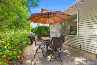 Patio area abuts green space