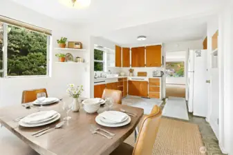 Virtually staged dining area and kitchen.