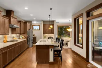 The kitchen is the heart of the home with a large center island with beautiful hardwood floors flowing from the foyer to the dining room.