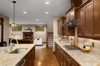 The kitchen is the central space, connecting to the living room and the stairway to the 2nd floor.