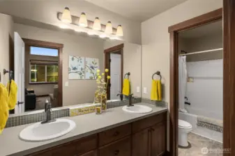 Upstairs 2nd full bath with double sinks and a separate water closet.