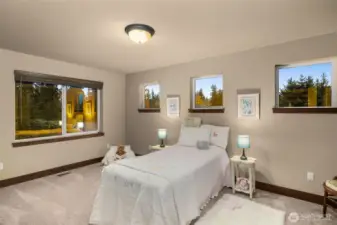 In addition to the primary suite, there are 3 large bedrooms upstairs.  Bedroom 3 of 3 upstairs. All bedrooms are large – this is a twin bed, but the room could easily accommodate a queen or king size bed.