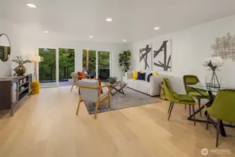 spacious living room connected to well-appointed kitchen