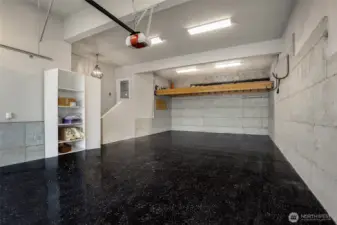 4-car garage with lift storage and built-in cabinets