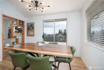 Bright dining room, with custom wood shelving.