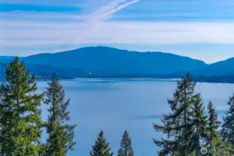 Sweeping Lake & mountain views set on a shy acre lot in an exclusive enclave of just 7 luxury homes in Bellevue