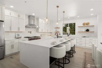 Oversized marble waterfall island designed for elevated entertaining & daily living