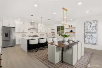 upgraded cabinetry, sleek countertops,premium appliances & an oversized marble waterfall island designed for elevated entertaining & daily living.