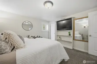 Looking across the primary suite toward the large primary bath.