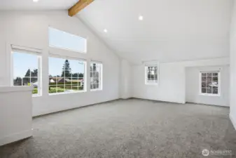 Looking across this spacious room that has west facing windows. There are mini-split heating systems here so there is heat and air conditioning as well.