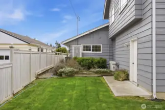 The landscape will begin blooming soon and it is a series of colors from spring to fall! This walkway leads to the large hot tub that remains with the sale of the home.