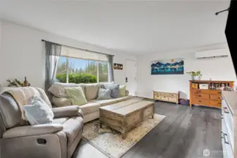 Living room for Unit 8313 offering the Ductless Mini Split for efficient heating & cooling, plus LVP flooring.